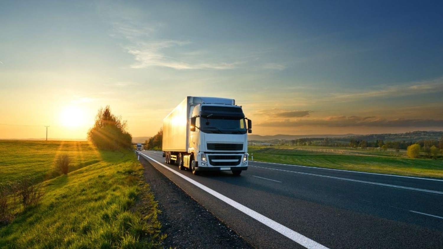 White truck driving on the road