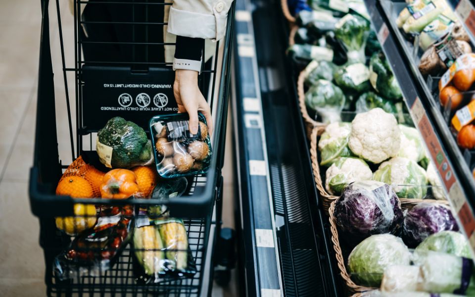 Pile of raw thin spaghetti in plastic container