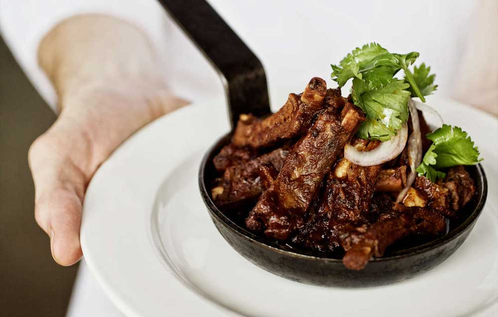 Food services - Waiter serving beef plate 