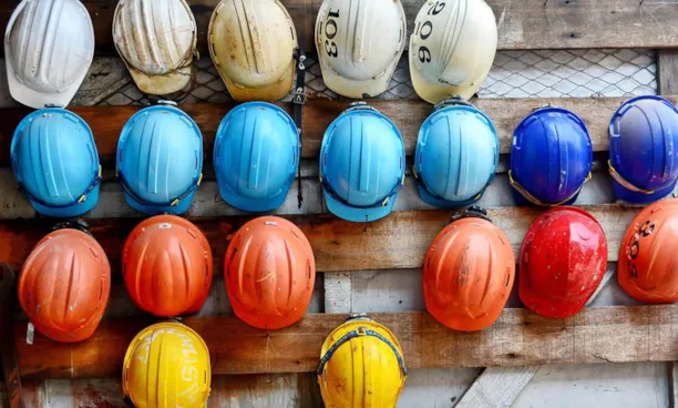 Colorful hard hats in a row