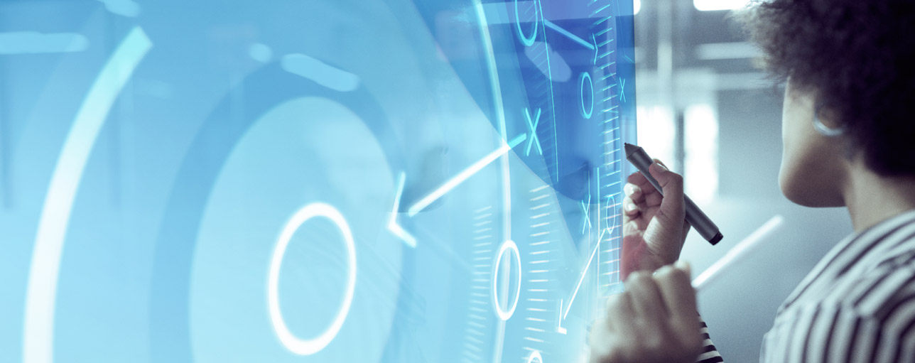 Woman in front of interactive screen